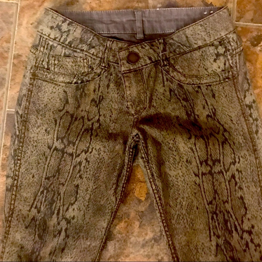 Jolt brand reversible snake print skinny jeans.